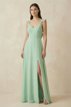 Robe demoiselle d’honneur pale pistachio longue à fines bretelles sans manches avec fente - Harana