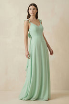 Robe demoiselle d’honneur pale pistachio longue à fines bretelles sans manches avec fente - Harana