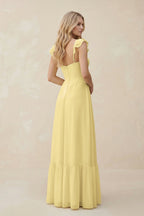 Robe demoiselle d’honneur pastel yellow longue effet drapé à volants en mousseline - Harana